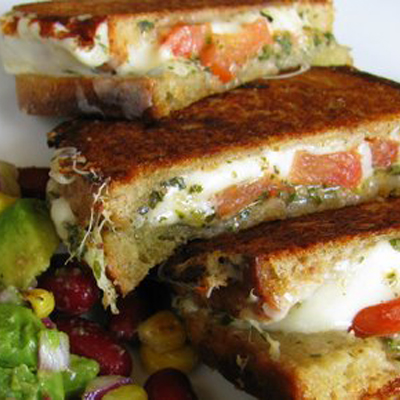 Bidding adieu to Grilled Cheese Month and ushering in a colorful spring with a Mozzarella Grilled Cheese Sandwich, with Avocado Salad.