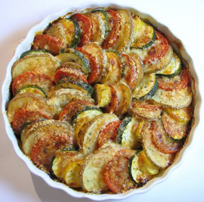 Vegetable Tian - a beautiful side dish with potatoes, tomatoes, yellow squash, zucchini, caramelized onions and garlic.