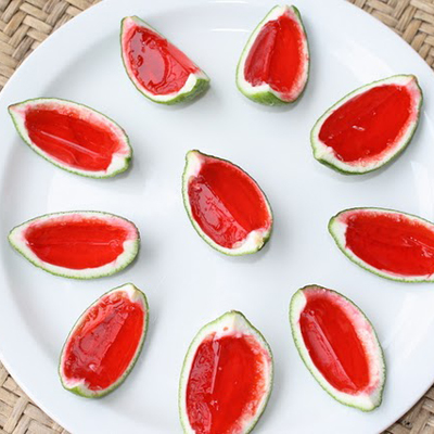Watermelon jello, and vodka in a lime peel, perfect for summer parties.