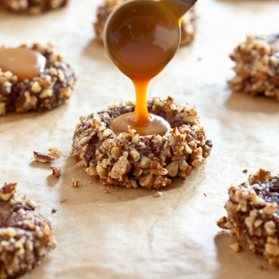These chocolate turtle cookies - gooey caramel nestled in a chocolate cookie coated in toasted pecans - are outstanding.