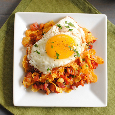 The Totally Absurd Breakfast Explosion Hash - crisp, salty pancetta, slightly sweet cornflakes, spicy sambal oelek and a sunny side-up egg.