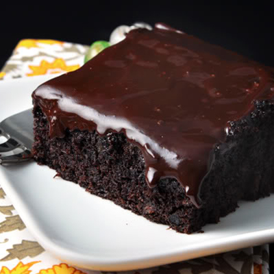 Deep, dark and delicious... you'll be surprised at the secret ingredient used in this super moist and uber-fudgy chocolate cake!