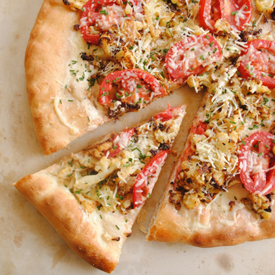 The best way to eat a vegetarian meal? On a PIZZA! Roasted Cauliflower & Garlic Pizza.
