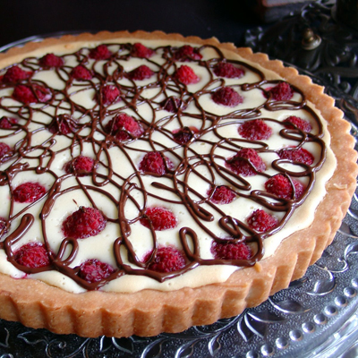 White Chocolate Cream Cheese Raspberry Tart. This dessert is sure to please everyone.