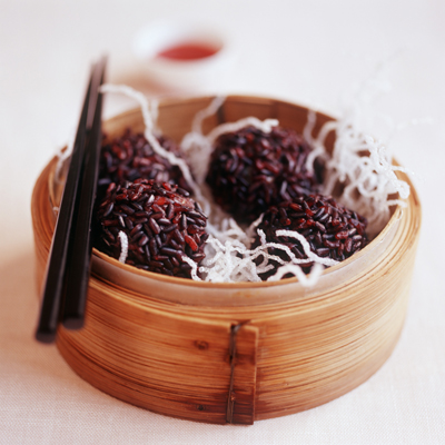 International meatballs recipe with red rice and fried noodles served hot and spicy.