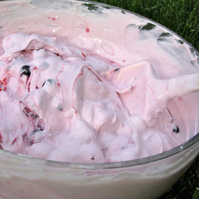Berries and Cream: frozen mixed berries, a tub of Cool Whip, a container of yogurt, and cheesecake pudding mix.