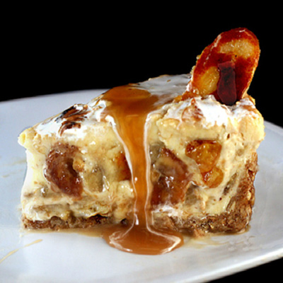 Caramelized Banana Pudding Cheesecake with Salted Cashew Praline - Vanilla Wafer Crust.
