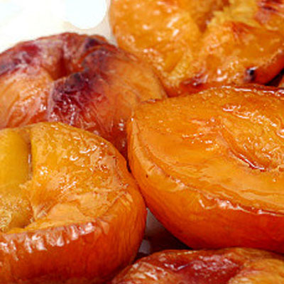 Buttery Brown Sugar Roasted Peaches - less than 100 calories for a dessert that tastes like soft candy.