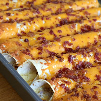 Breakfast Enchiladas ~ Tortillas stuffed with sausage, bacon and eggs made the night before.