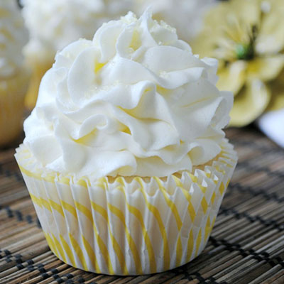 Lemon Cupcakes... the best white cake batter from scratch with a hint of lemon, topped with a lemon buttercream frosting!
