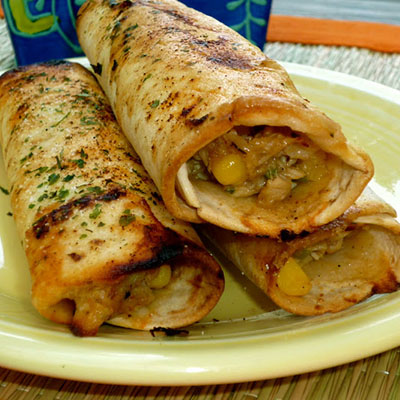 Crispy Chicken Tortilla Rollups ~ Brushed with garlic & cilantro oil and baked to a crisp. The creamy chicken filling is delish!