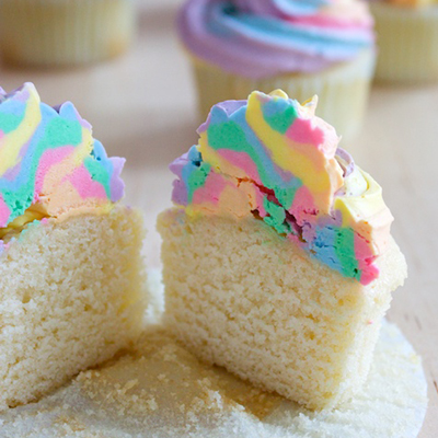 Classic cupcakes topped with rainbow colored frosting that kids will go crazy for!