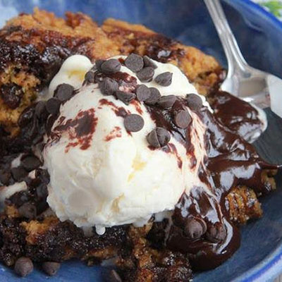 Heaven In A Crockpot - 1 box brownie mix, 1/2 c butter, 4 eggs 1 pouch chocolate chip cookie mix. Top with ice cream!