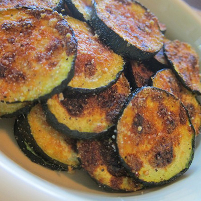 Zucchini Chips! Only 60 Cals!!! Make these in the oven on a cookie sheet with olive oil and parmesan cheese!