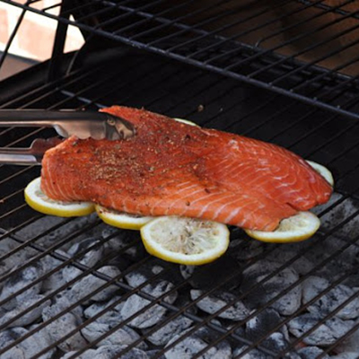 Grill your fish on a bed of lemons to infuse flavor & prevent sticking to the grill. GREAT idea!