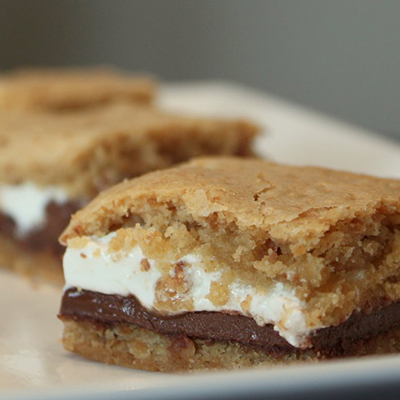 Baked Smores Bars... these were SO stinking good! It was like a party in my mouth and I'm not kidding. I'm not even a big smores fan and these were so good that I am going to have to make them again and again, everyone loved them, and they didn't last long at all!