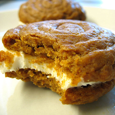 Pumpkin cookies with cream cheese filling for fall!