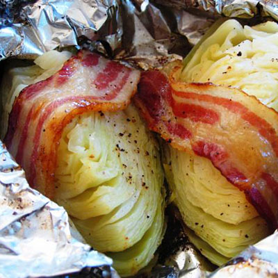 Grilled cabbage. "If you have never had it grilled you are missing out! Cut a head into 4~6 peices, put each on a piece of foil add a couple spoonfuls of butter, and top with bacon if desired. season it with season salt."