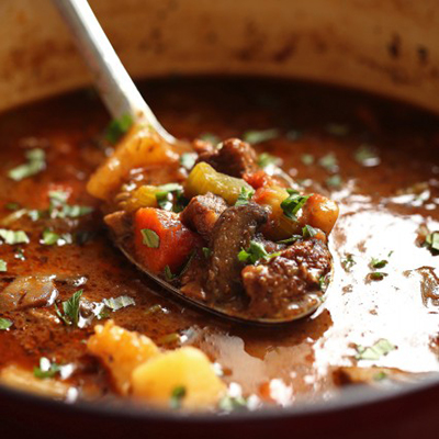 Italian Beef Stew. Ingredients: Celery, yellow onion, carrots, potatoes, mushrooms, chopped tomatoes, garlic, beef, beef stock, flour, seasoning, red wine vinegar, oregano, marjoram, thyme, rosemary, bay leaf, fresh parsley, fresh basil and parmesan cheese.