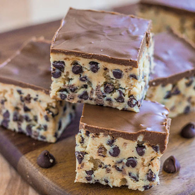 Chocolate Chip Cookie Dough Bars. If you are guilty of eating raw cookie dough this recipe is for you! Amazing bars that are no bake and egg less that you will love!
