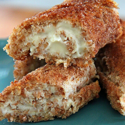 Cinnamon Sugar Cheesecake Roll-Ups. So easy and so tasty... little bites of cinnamon cheesecake with a crunchy crust.