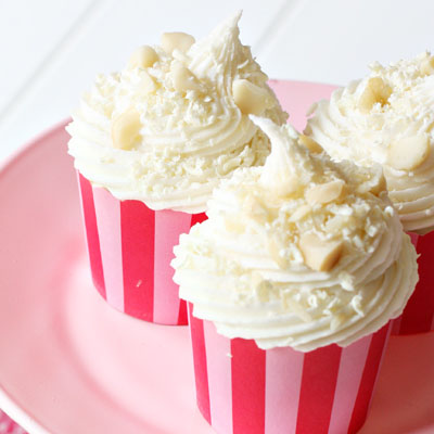 Did you know you can make frosting flavors with coffee creamers?! White Chocolate Macadamia Nut Cupcakes!