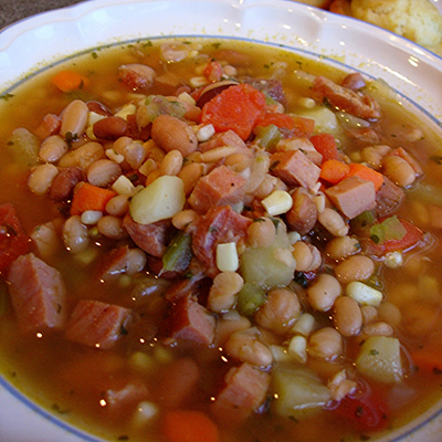 Ham-bone Soup... with mixed beans & lentils, ham, corn & tomatoes all cooked in a rich seasoned broth.