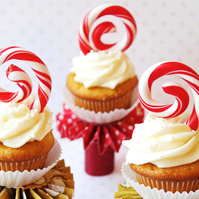 Love the idea of heating the candy canes just enough to "shape" them as cupcake toppers. Something very unexpected from a traditional look.