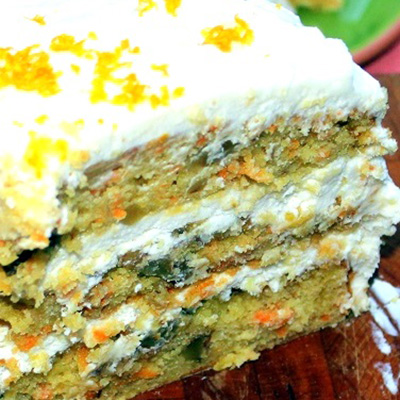 LOADED Caribbean CARROT CAKE with Pineapple Cream Cheese Frosting... And when I say loaded I mean it... Pineapple, Banana, Walnuts, Coconut and of course carrots! The Pineapple Cream Cheese recipe is FANTASTIC, a great sweet topper to a fruit heavy dessert! I LOVE this CAKE!