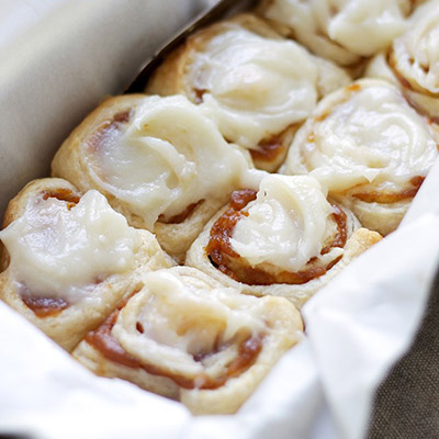 Pumpkin Pie Cinnamon Rolls in under one hour made with refrigerated dough, a delicious pumpkin filling, and an incredible pumpkin pie spice cream cheese frosting!