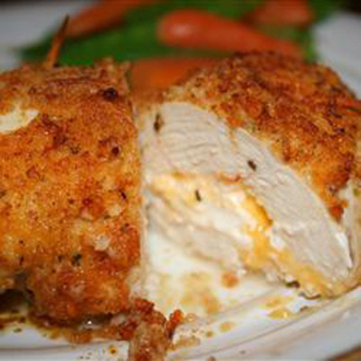 "Not your everyday chicken dish! Stuffed with Cheddar and cream cheeses, then drenched with a garlic-lemon-butter sauce, your friends and family will be begging you to make this recipe."