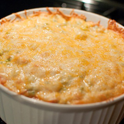 LAYERED FIESTA TACO SALAD BAKE ~ layers of crushed tortilla chips, beef, tomatoes, green onions, heaping load of cheese, after that is baked top with avocado, shredded lettuce, and any other fixin’s you’d like... yum!
