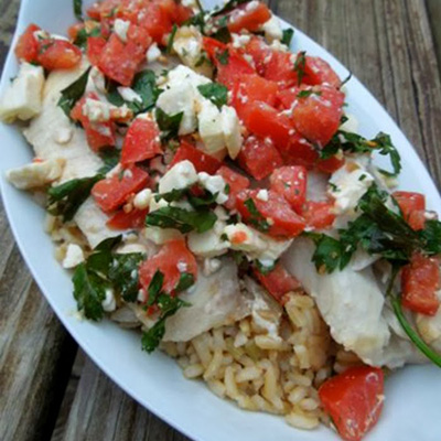 This beautiful Greek Roasted Talapia is one of my favorite seafood recipes. The salty feta, tangy tomatoes and garlic give this inexpensive fish a ton of flavor.