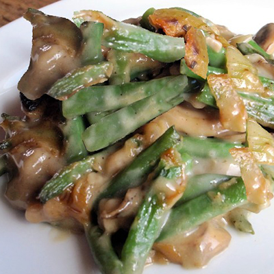 Green Bean casserole with mushrooms bacon cheddar and no soup... and so delicious.