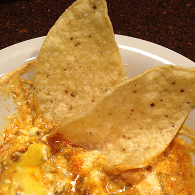 Taco Dip: hamburger meat, taco seasoning, sour cream & Velveeta cheese.