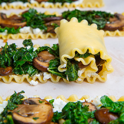 Mushroom and Kale Lasagna Roll Ups in Creamy Gorgonzola Cauliflower Sauce
