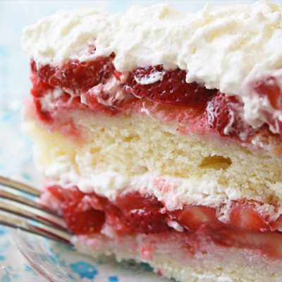 Strawberry Cake - A show-stopping cake made with fresh berries and covered with whipped cream... Wow!