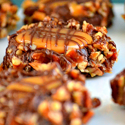 Turtle Thumbprint Cookies - Chocolate cookies rolled in pecans and filled with gooey caramel - perfection!