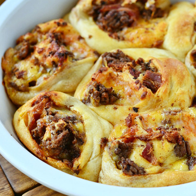 Bacon Cheeseburger Pizza Pinwheels are a fun way to enjoy all the fantastic flavors of a Bacon Cheeseburger Pizza!