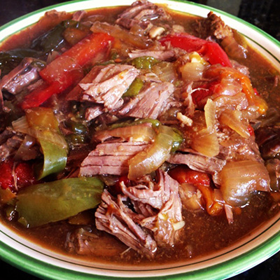 Slow Cooker Pepper Steak. This meal literally took 12 minutes to prep and get into the cooker...fork tender lean beef, sweet peppers and onions and an awesome sauce to go over top. Served over brown rice.
