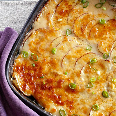 Creamy Scalloped Potatoes Recipe ~ Cream cheese is the secret ingredient that gets you to an easy no-fail scalloped potatoes packed with flavor!