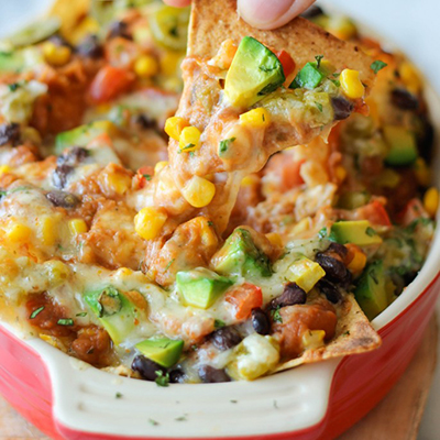 Loaded Nachos - Loaded with both refried and black beans, you definitely won't be missing the meat in these cheesy, vegetarian nachos!