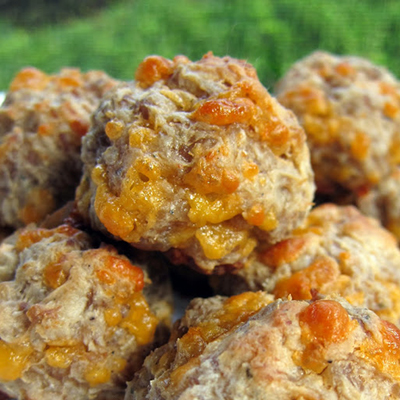 *For Christmas Eve* Secret ingredient is cream cheese. The cream cheese keeps the sausage balls very moist and tender. We used hot sausage to give the sausage balls a little kick, but regular sausage would work well too. Bring these to your next tailgate party - you won't be sorry! Cream Cheese Sausage Balls (Printable Recipe) 1 lb hot sausage, uncooked 8 oz cream cheese, softened 1 1/4 cups Bisquick 4 oz cheddar cheese, shredded Preheat oven to 400F. Mix all ingredie...