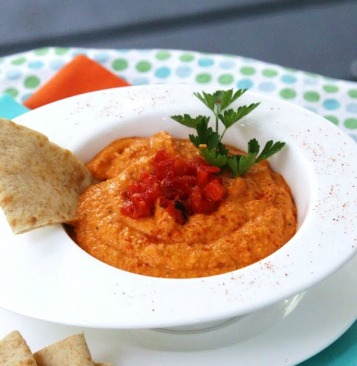 Roasted Red Pepper Hummus - Sure, you can pick some up at the market, but it is so insanely easy to make (not to mention tastes great) that there's no reason not to make it from scratch. Basically, you dump it all into the food processor and give it a whirl! Step-by-step photos!