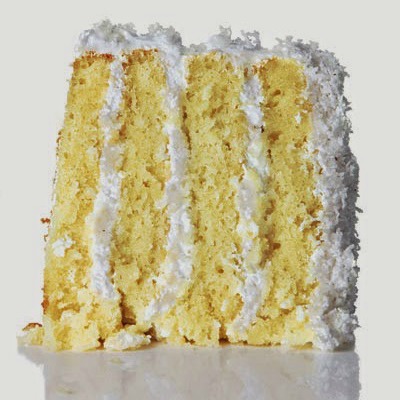 Coconut Cake ~ The cake is moist and buttery while the icing is a fluffy cloud of coconut perfection. Fresh coconut and it's sweet water are the keys to this cake. If you're a coconut fan, you must try. A yummy dessert for lunch or dinner - or even an afternoon snack! 