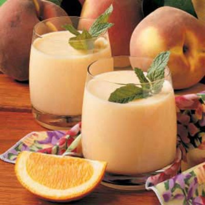 Peach Smoothies • 2 cups milk • 2 cups frozen unsweetened sliced peaches •1/4 cup orange juice concentrate • 2 tablespoons sugar •5 ice cubes.  Directions •In a blender, combine all ingredients; cover and process until smooth. Pour into chilled glasses; serve immediately. Yield: 4 servings. Very refreshing and tasty!