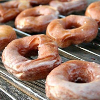 Pumpkin Spice Doughnuts with buttermilk spiced glaze. These doughnuts are super delicious and are what's for breakfast! If you love Krispy Kreme then you'll love these.